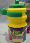 Sesame Street Elmo Water Bottle with pull up spout 5 1/2 inches high 2 1/2 inch diameter