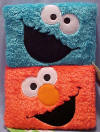Gund Sesame Street Cookie Monster & Elmo Plush Photo Albums - holds up to 40 4" x 6" pictures. cover of album is an extremely soft plush Each album is approximately 7 1/2 inches wide by 5 inches high by 1 1/4 inches deep.