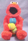 Gund Musical Elmo with Letter Blocks - Elmos head moves as he plays the "Sesame Street Theme Song"  15 inches high
