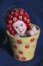 Anne Geddes, the world known baby photograph, has out done herself with these Babies in Flower Pots Ornaments.