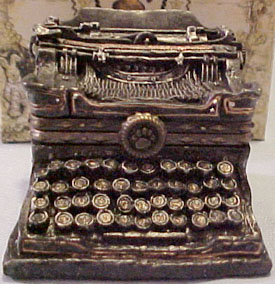 2nd Edition Boyds Uncle Beans Treasure Box Wilson's Typewriter with Underwood McNibble Mouse 2nd Edition Boyds Uncle Beans Treasure Box Wilson's Typewriter with Underwood McNibble Mouse
- Introduced Spring 2002 and has been retired
- This is a Limited Edition piece of 6,000
- A great gift for a writer! Our typewriter-shaped treasure box opens to reveal a special message and a tray of writing supplies. Underneath is our McNibble novelist preparin' a great work of fiction (has sumptin' to do with The Head Bean bein' a genius!).
- "It was a dark and stormy night..."
- Quote on bottom: "I love being a writer. What I can't stand is the paperwork." - Peter De Vries