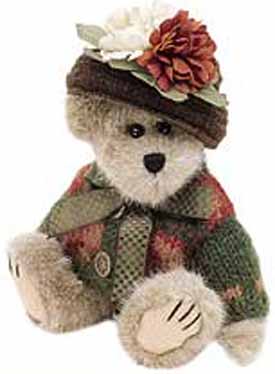 Boyds Aunt Fanny Fremont Teddy Bear Boyds Aunt Fanny Fremont Teddy Bear
- introduced Fall 1999 and has been retired
- During that long Hibearnation last winter, Aunt Fanny sat in the den, knitting and crocheting her lovely Ensemble. (You thought all those Bears did was Sleep?!) Now that the chilly days of Autumn are here once again, Fanny gets to show off her creation...her nephew Logan added those lovely Silk Mums to her hat just as they set out for their visit to the City. What a nice touch!