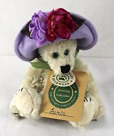 Boyds Twila Higgenthorpe Teddy Bear Boyds Twila Higgenthorpe Teddy Bear
- introduced Spring 1997 and has been retired
- When the birds sing the Songs of Spring, you can be sure Twila Higgenthorpe is not more than an ear away. Wearing her newest Hattery, a Lavender Cloche trimmed with colorful Silk Flowers (roses are her Favorite!). Twila is a beautiful light beige Chenille furred bear.