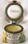 Open view of Baby Boyds Lil Globe Treasure Box Toofey G Bear Pink First Tooth - (introduced Spring 2005) Create a keepsake to commemorate an important milestone for baby girl when you safely stash her first tooth inside the hinged box base of this mini waterball! Inside box lid reads: "DREAM" and "First Tooth" (not a toy) 3 1/4 inches
