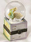 Front view of Baby Boyds Lil Globe Treasure Box Newby to record newborn height and weight  introduced Spring 2005 &nbsp;A cherished memento of baby's homecoming...mini waterball features baby bear cub and stork. Personalize yourself with baby's name, birth date, weight and height and stash a special lil' sumptin' inside the treasure box!  Inside box lid reads:  A baby is God's way of saying the World should go on (not a toy) 3 1/4 inches