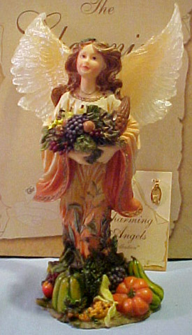Boyds Charming Angel Aurelia "Guardian of Harvest" - (introduced the Fall of 2002 and has been retired) Hard work and determination are not in vein; the fruits of our labors are worth the effort put forth. Aurelia... Guardian of Harvest guides and protects us as we work toward our goals and helps us to reap ther rewards. She looks after the farmer in the field, the student who strives for excellence, and those who seek to better their situations in life. She holds in her hand a cornucopia - a symbol of prosperity and plenty. (she comes with an embedded cornucopia 24kt Gold plated charm) On the bottom of the figure it reads: "Always do your best. What you plant now, you will harvest later." - Og Mandins 6 3/4 inches high