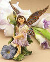 1st Edition Boyds Glory  Faeriesprites Fairy Stained Glass Wings Figurines (introduced Spring 2006)&nbsp; Just like the bright indigo blooms that greet a gorgeous summer morning, Glory wakes up the happiness of the morning with a big smile, stained glass-like wings and pretty morning glory bloom.  Quote:&nbsp; "Happiness held is the seed; happiness shared is the flower." - Anonymous  3 1/4 inches