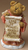 Boyds God's Lil Angel Bear Joshua "Life is Fragile..." - (introduced Fall 2004 and has been retired, made of cold cast resin.) A sweet little angel bear that sends blessings your way. Joshua is dressed in a robe of pink and holds a "Life is Fragile...handle with prayer" scroll. 3 1/4 inches high 1 1/2 inches wide
