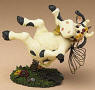 1st Edition Boyds Holy Cow Paddy Bobble Body (introduced Spring  2004 and has been retired)  Better watch where you're steppin' in the cow patch! Paddy's about to land in a pile of "doo." This lil' country cow features a jiggling body and a cow bell collar.  Quote:"Everything is funny as long as it happens to somebody else." - Will Rogers  5 1/4 inches long 3 1/2 inches high