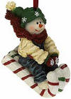 2nd Edition Boyds Frannie Sweetride Riding on a Candy Cane Sled Snowman Ornament - (introduced Fall 2003 and has been retired)  Frannie's flyin' down the mountainside! This Snow Dooode wears overalls, a snowflake cap and mittens, and knit scarf, and rides a sparkle-coated candy cane sled.  2 1/4 inches high by 3 1/2 inches wide