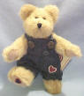 Boyds Jimmy T Bearheart - (introduced Spring 2003 and has been retired)  This FABULOUS Best Dressed Varigated Beige Bear is wearing a denim jumpsuit with metal buttons which are decorated with hearts.  There is a red heart embroidered on its pant leg and a black heart trimmed with red embroidered on the bottom of his right foot.  (safe for ages over 3) 6 1/2 inches