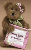 Boyds Mocha Teddy Bear with Quilt "Beary Best Grandma" - (introduced Spring 2004 and has been retired)  This mocha bear wears a satin ribbon bow and holds an embroidered quilt square-the perfect gift from kids to grandma!  poseable  (safe for ages over 3) 8 inches