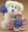 Boyds Grandma Kisses White Butterfly Teddy Bear with Plush Flower "Butterfly Kisses for Grandma" - (introduced Spring 2005 and has been retired)  Let's not forget Grandma is a mom too! White sparkle fur jointed bear with blue butterfly wings holds pink and blue flower embroidered with "Butterfly Kisses for Grandma."  (safe for ages over 3) poseable 7 inches