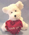 Boyds Bear Hugs White Teddy Bear - (introduced in 2002 and has been retired) &nbsp;This EXTREMELY SOFT AND CUDDLY White Bear is made from the new materials which makes it hard to leave alone!  It is holding a red heart shaped pillow with 'Love Ya!' embroidered on it in white.  It is limited to Valentines Day 2003.  (safe for ages over 3)  8 inches