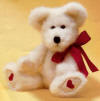 Boyds Valerie B Bearhugs White Teddy Bear - (introduced in 2000 and has been retired)  He has super soft extremely white fur.  He has red embroidered hearts on the bottom of both feet.  There is a red ribbon tied in a bow on his neck.  He is poseable - arms, legs, and head move. (safe for ages over 3) 11 inches 