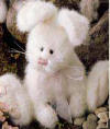 Boyds Fluffie Bunnyhop Bunny Rabbit - (introduced Spring 2000 and has been retired) Forget about spotting those Robins fluttering 'round the yard - around here, the first signs of Spring are (1) warmer weather and (2) the Bunnyhop Girls hitting the old Bunny Trail! Fluffie is working on eradication of a bad case of Cabin Fever (it wuz a l-o-n-g winter) by cavorting in the spring Sunshine...the good doctors of Boydsville have prescribed a daily dose of Hippety and a double dose of Hoppety to get her "Bounce" back! (safe for ages over 3) 8 inches