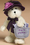 Boyds Ineeda Bargain White Teddy Bear in Burgundy Hat - (introduced Spring 2004)  Ineeda has a compulsion to spend, spend, and shop till the stores close (but never forgets her coupons)! This cream bear features a purple velvet hat with voile carnation and black net veil, a satin ribbon bow, and a felt shopping bag with mini wrapped packages.  Shopping bag reads:  "Shop til you drop."  (safe for ages over 3)  8 inches and poseable