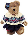 Boyds Leisel L Burrbruin Teddy Bear - (introduced Fall 2002 and has been retired)  &nbsp;After a day of skiing and sledding, Leisel kicks back by a roaring fire and enjoys hot cocoa. This cinnamon bear's wearin' the lastest ski resort style-a corduroy bow with mitten button, a berry red turtleneck, a knit sweater, a pleated corduroy skirt, and red knit panties. (safe for ages over 3)  10 inches and poseable