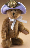 Boyds Lily LeFleur Teddy Bear in Lavender Hat with Flower- (introduced Spring 2005 and has been retired) Lily LeFleur is all ready for the garden tea party! Jointed mocha bear features a lavender hat with a green flower.  (safe for ages over 3)  6 inches and poseable