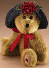 Boyds Madison Teddy Bear in a Denim Hat with a Flower and Red Star on Foot - (introduced Fall 2005)  Hats and such girls go Americana! Madison is a gold, poly filled bear in a blue denim hat, red neck bow and star paw pad embroidery.  6 inches and poseable