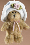 Boyds Hats and Such Goldie in White Hat Jointed Teddy Bear Plush Ornament - (introduced Fall 2005) The perfect finishing touch to a package or gift basket...hang 'em up, sit 'em around...just have fun with 'em! Fully-jointed and 3.5"H with ribbon neck bow and hanger. Goldie wears a blue velvet hat with a light purple satin rosette.  (safe for ages over 3)  3 1/2 inches and poseable