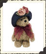 Boyds Yvette Dubeary Teddy Bear - (introduced Spring 1999 and has been retired)  In her Navy hat trimmed with two Lovely Blooms, Yvette Dubeary has just what it takes to be one of Boydstown's Socialites. A beautiful furry plush brown bear that is poseable.  6 inches and poseable