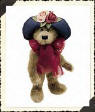 Boyds Aunt Yvonne Dubeary Teddy Bear - (introduced Fall 1998 and has been retired)  Aunt Yvonne Dubeary is looking good in her upturned Rim Hat of True Navy. She is fond of those dried Blooms to accessorize all her Fashion Accoutrements. What better accents for a Garden Stroll than two Springtime Blossoms to match her Red voile scarf?  11 inches and poseable