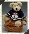 Boyds Breezy T. Frostman Teddy Bear - (introduced Fall 1999 and has been retired)   When Breezy builds his first Snowman this winter, he'll need only to look at his Sweater for a "How-To". Mom knows that little bears' heads are stuffed with Important Things (like learning to say Please and Thank You and to look both ways before crossing the Street), so she knitted in a Helpful Guide for her little guy's first attempt at Sculpture. (Not counting all the times he "sculpts" with his Mashed Potatoes, that is!)  A beautiful Chenille Furred bear with a knitted snowman sweater  8 inches and poseable