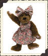 Boyds Liza J. Berrijam (20th Anniversary Special Seal Tag) -  (introduced Spring 1999 and has been retired)  The minute Liza saw this cheery Chintz Print on one of her famous "Shop Til You Drop" expeditions to the Mega-Mall, she had to buy every inch that was available! Being an excellent Seamstress, she put this "informal" Jumper and Headband outfit together in just 3 hours...givin' her just enough time to hit the stores (again!) for shoes to match...but as you can tell by her bare-pawed appearance, she's still looking! Liza is an adorable little bear with soft chenille fur.  10 inches and poseable