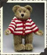 Boyds Teddy Bear Waldo Bearsworth - (introduced Fall 1999 and has been retired) In a handknit Cardigan Sweater of true red and white Stripes, this is one distinctive Bear. He'll stand out in any Crowd...unless they're all munching Candy Canes. Waldo has soft beige fur.  11 inches and poseable