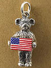 Boyds Sterling Silver Teddy Bear Charm Samuel Bear with American Flag - (introduced Fall 2004 and has been retired) Created by Boyds Master Designers, our Samuel charm holds onto a hand-painted American flag, and is made from solid sterling silver and captures the same detail found on Boyds' award winning Bearstone figurines! 1/2 inch in size