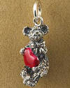 Boyds Sterling Silver Teddy Bear Charm Lovey Bear with Red Heart - (introduced Fall 2004 and has been retired) Lovey, a bear charm holding onto a red heart is created by Boyds Master Designers. Made from solid sterling silver and captures the same detail found on Boyds' award winning Bearstone figurines! 1/2 inch in size