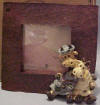 Boyds Noah's Ark Stretch & Skye Giraffe Picture Frame - fits a 1 1/2" square photo  (introduced Spring 2000 and has been retired)   Stretch and Skye will help you remember how to hold yer head High (despite bein' Seasick!) on your next voyage with this red trimmed frame. It's easy to carry along on yer next jaunt across the rolling waters...and Flood proof, too! 2 3/4 inches square