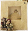 Boyds Packy & Dermah Elephants Picture Frame - (introduced Spring 2000 and has been retired)  As experts in the luggage department, Packy and Dermah will tell ya that even when their trunks are full, there is always a little extra room for carryin' their favorite snapshots. They'll be happy to pose with you, too...for a few Peanuts of course!  2 3/4 inches square