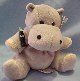 Coca Cola plush Hippos are cuddly soft stuffed animals. He wears a tag which describes information about Coca Cola in the country the Hippo came from.