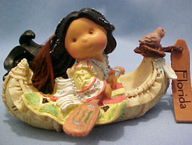 Friends of a Feather Florida Canoe with Indian Girl Figurine Friends of a Feather Florida Canoe with Indian Girl Figurine
- made of cold cast resin