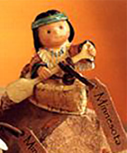 Friends of a Feather Minnesota Canoe with Indian Boy Figurine Friends of a Feather Minnesota Canoe with Indian Boy Figurine
- made of cold cast resin