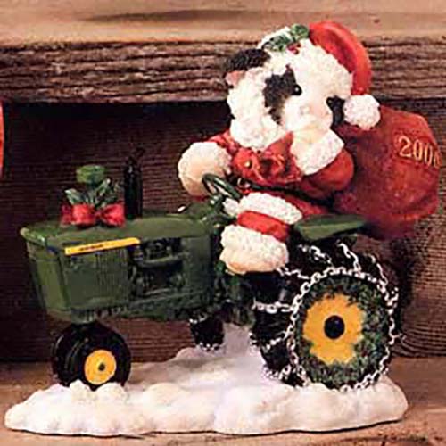 Mary Moo Moos adorable Cow Figurines dressed up for Christmas and riding John Deere Tractors. Made by Enesco for Christmas 2000.