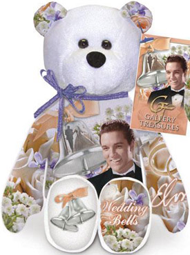 Limited Treasures Elvis 'Wedding Bells' Teddy Bear Limited Treasures Elvis 'Wedding Bells' Teddy Bear
- this is the 17th bear in the series
- The back of the bear has a large picture of wedding bells and the words Marriage and Love. The tag and bear have picture of Elvis in a tuxedo and Wedding Bells in several places. Elvis looks REALLY handsome in his black tuxedo.
- The tag reads: "On May 1, 1967, Elvis marries his first love, Pricilla Beaulieu in Las Vegas, Nevada. They later have a wedding reception in Memphis at the Graceland Mansion." Elvis was a true romantic, recording more than 50 love songs in his career, with many in the Top 20 Billboard Singles. Some chart toppers include, "Love Me Tender," and "Can't Help Falling in Love."