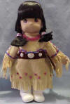 Precious Moments Doll Jicarilla Apache (12 1/2" H) (1996 Precious Moments, Inc.) The arms, hands, legs, feet, and head are hard plastic. The body is plush. Her tag reads: "American culture owes much of its richness to the contributions of Native Americans, from their traditions, art, crafts, music, religion, and leadership. PRECIOUS MOMENTS salutes the American Indian people. Crossed arrows with hearts on the end represent friendship. Precious Moments never end when shared with a forever friend. Native American Indians Doll Collection Huwuni, Dawn, Apache. This doll is a cherished part of our Precious Moments Native American Indians Doll Collection. She is a Limited Edition collectible doll, a creation of the finest quality and workmanship. This certificate of authenticity verifies that the doll is an exclusive Limited Edition. Only the finest materials have been used in the making of this doll."