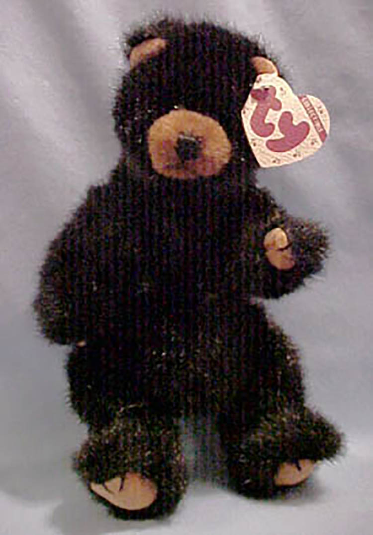 TY Attic Treasures Ivan Black Teddy Bear TY Attic Treasures Ivan Black Teddy Bear
- introduced in 1995 and retired on 7/13/99
- Fully jointed plush black and brown bear
- Designed by Ty Warner