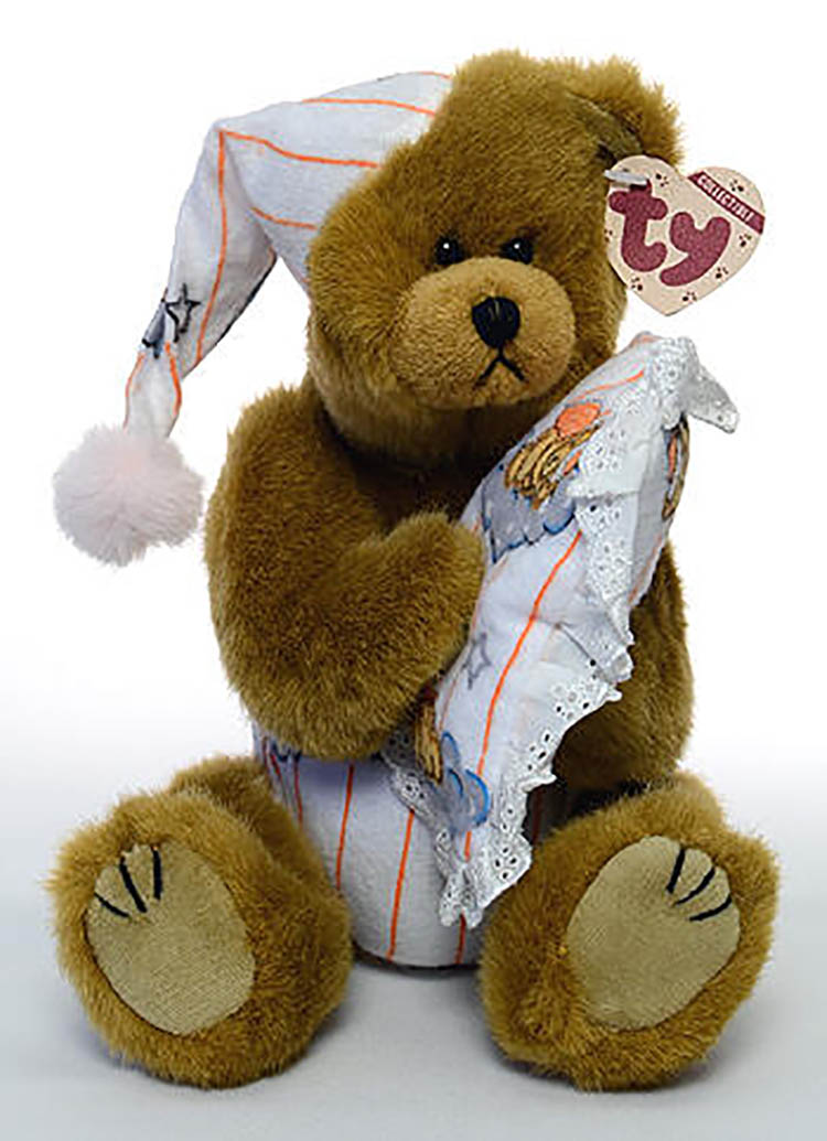 TY Attic Treasures Precious Teddy Bear TY Attic Treasures Precious Teddy Bear
- introduced on 1/1/98 and retired on 9/20/98
- Fully jointed plush golden brown teddy bear
- He is dressed in a flannel night cap and diaper. In his paws is his pillow
- Designed by Ty Warner