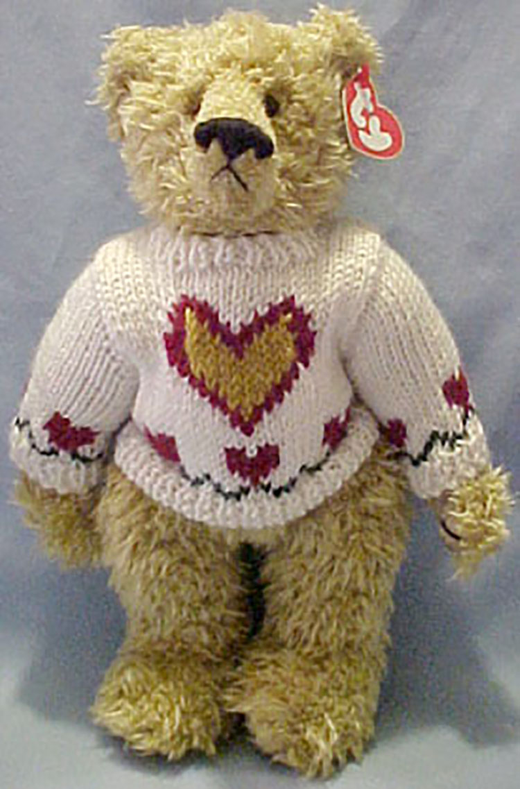 TY Attic Treasures Heartley Teddy Bear with Red Sweater TY Attic Treasures Heartley Teddy Bear with Red Sweater
- red heart tag
- introduced on 1/1/99 and retired on 5/22/00
- Fully jointed plush tan teddy bear
- He is wearing a creamy white sweater with a heart design
- Designed by Ty Warner