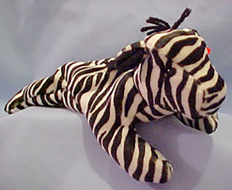 TY Beanie Babies Ziggy the Zebra Stuffed Animal TY Beanie Babies Ziggy the Zebra Stuffed Animal
- Introduced 6/3/95 retired 5/1/98
- DOB 12/24/95
- Poem: "Ziggy likes soccer - he's a referee, That way he watches the games for free, The other Beanies don't think it's fair, But Ziggy the Zebra doesn't care!"