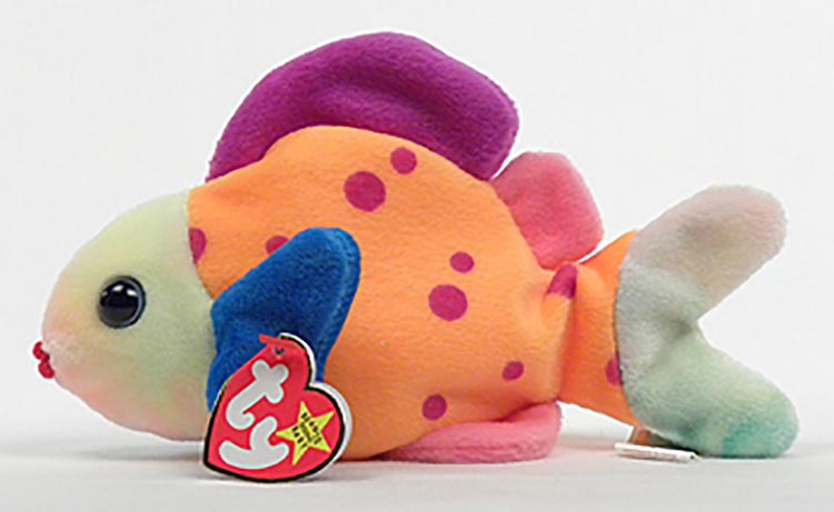 TY Beanie Babies Lips the Fish Stuffed Animal TY Beanie Babies Lips the Fish Stuffed Animal
- Introduced 7/14/99 retired 12/23/99
- DOB 3/15/99
- Poem: "Did you ever see a fish like me? I'm the most colorful in the sea, Traveling with friends in a school, Swimming all day is really cool!"